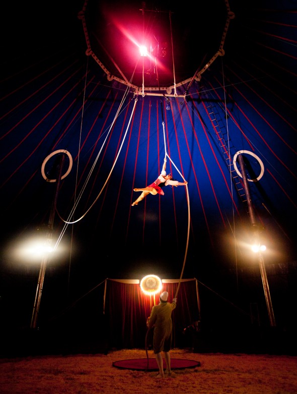 Clown Jay Walter (bottom) controls the rope while his wife, Tosca Zoppé performs her aerial routine at the Zoppé Family Circus in Westhampton Beach, July 25, 2013. Photo by Jeffrey Basinger / Newsday